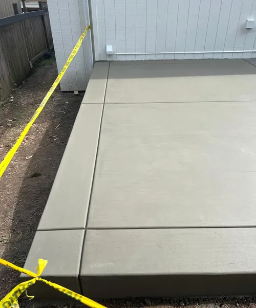 Broom finish patio and decorative borders in Covington 